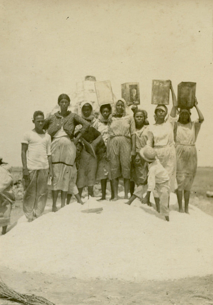 The locals posing on a pile of salt, 1923
